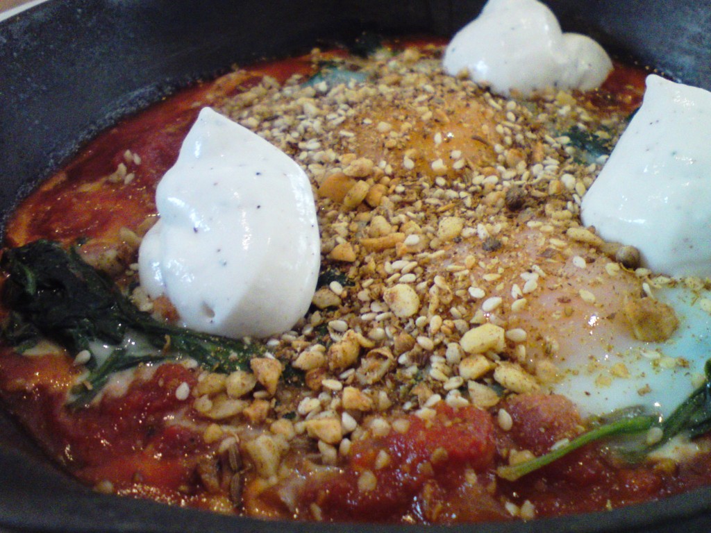 cummulis inc Turkish baked eggs, spiced tomato, dukkah and labne close up