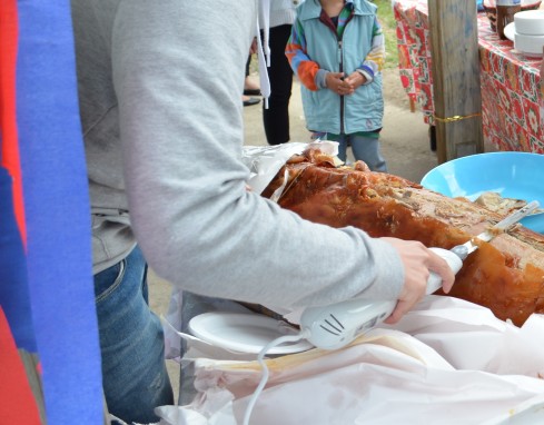 carving up lechon