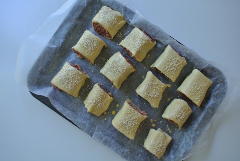 sausage rolls with sesame seeds up high